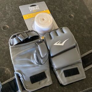 Pair Everlasting kick boxing gloves (L/XL) with cotton wraps.